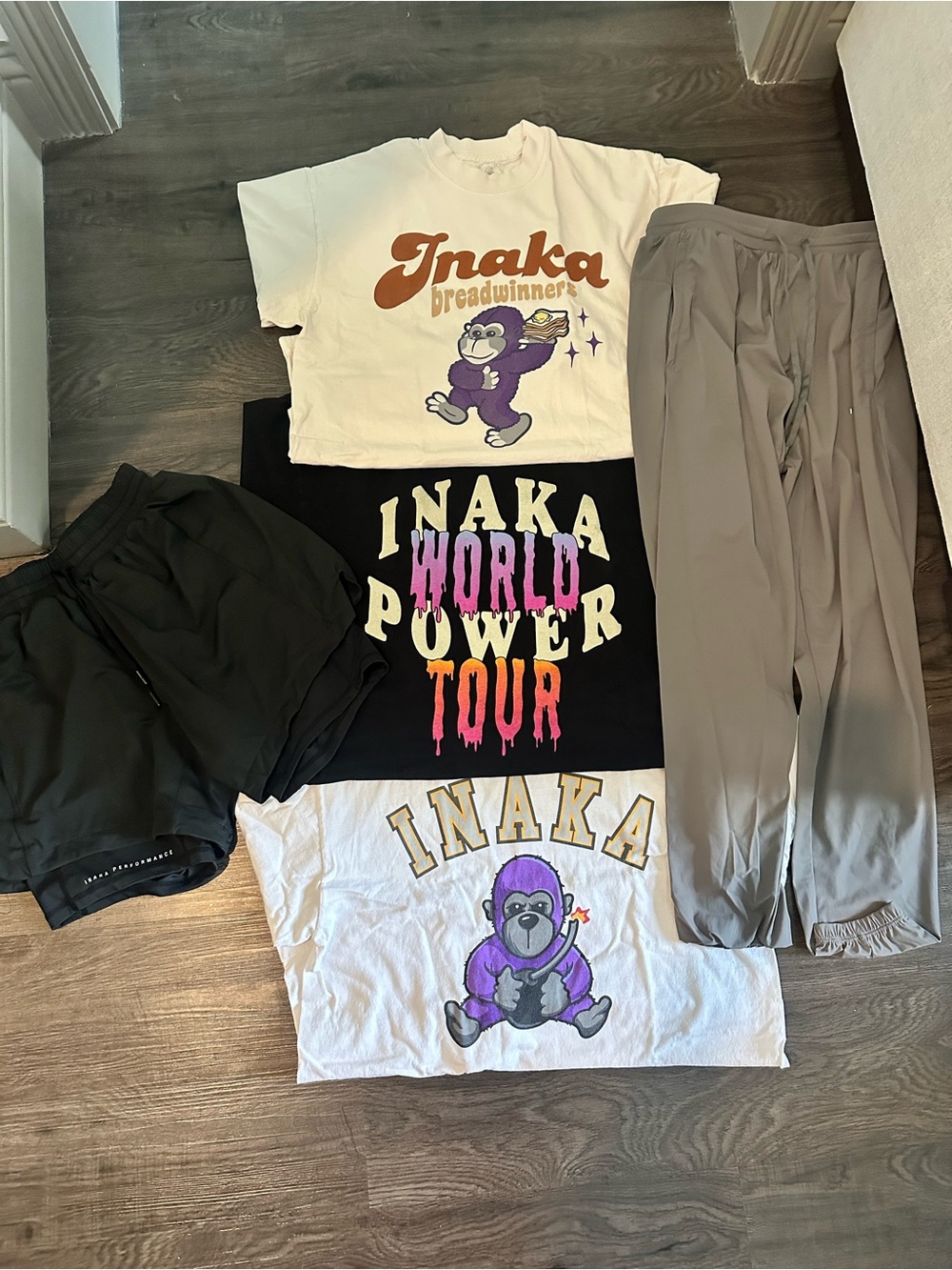 Inaka Power bundle of three t-shirts, one pair of shorts, and one pair of pants